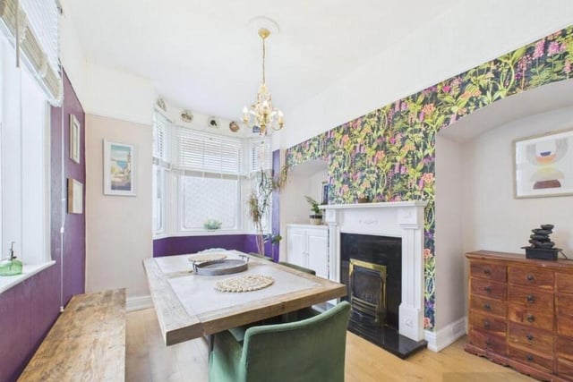 A double aspect dining room, again with a feature fireplace.