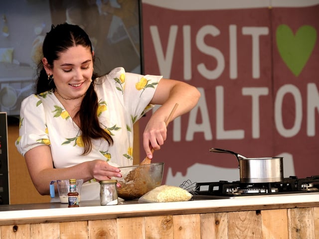 Great British Bake Off star Freya Cox giving a cooking demonstration.