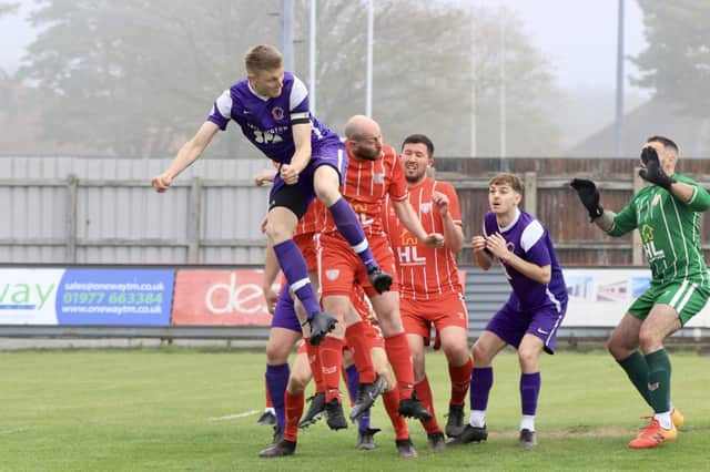 Brid Spa rise highest for a header in the ER League Junior Cup final win against Springhead. PHOTOS BY TCF PHOTOGRAPHY