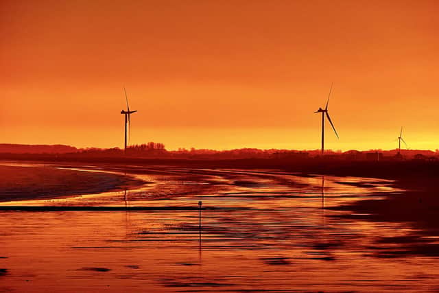 An orange-steeped photo of south beach, by Aled Jones.