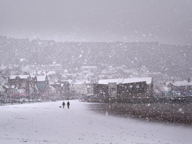 Snow falling on South Bay