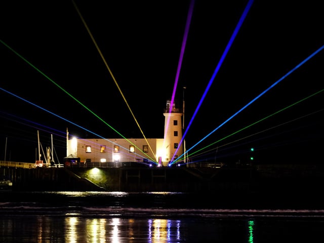 Lasers lighting up Scarborough lighthouse.
picture: Richard Ponter