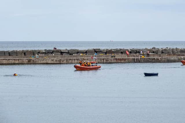 Staithes and Runswick and Redcar RNLI lifeboat crews take part in a demonstration rescue during lifeboat weekend - Image: RNLI/James Stoker