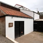 Built in 1860, the old smokehouse has been restored and is now a gin distillery