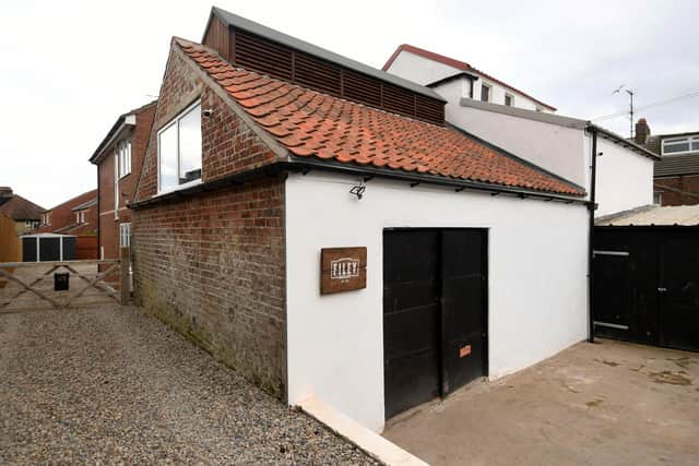 Built in 1860, the old smokehouse has been restored and is now a gin distillery