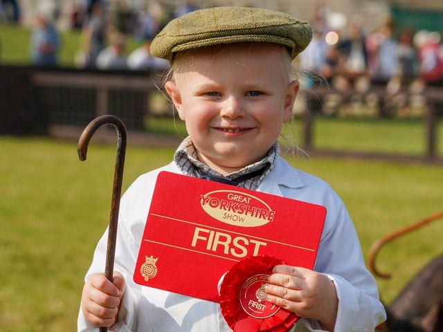 Arlo Dyas (aged three) who was awarded first place in the Young Pig Handlers competition