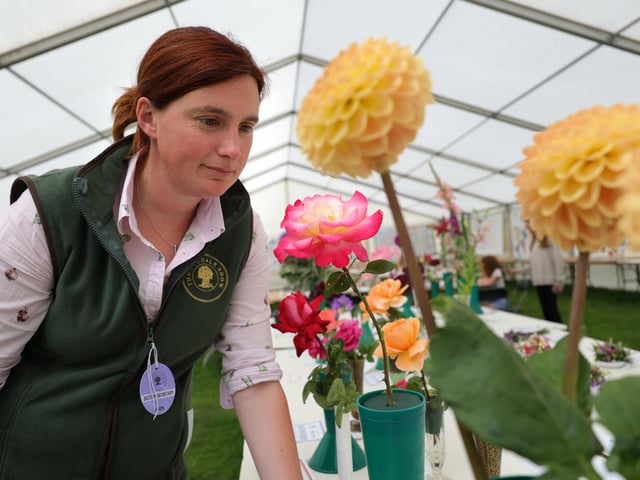 Produce Secretary Jo Dowson viewing some of the display flowers