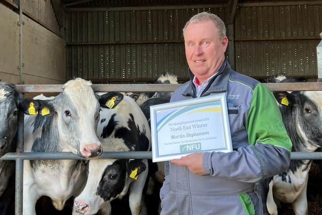 Martin Stephenson shows off his award