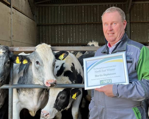 Martin Stephenson shows off his award