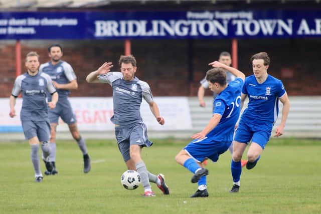 Bridlington Rovers Millau (grey kit) take on North Cave in the East Riding FA Senior Country cup final at Queensgate. Photo by TCF Photography