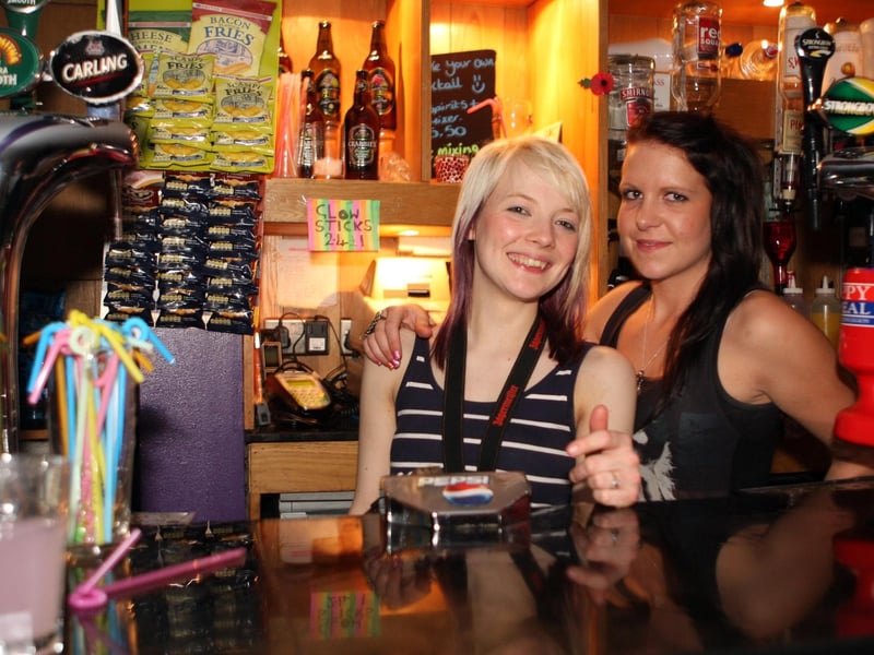Chelsea and Laura behind the bar at The George