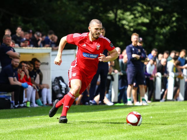 Striker Frank Mulhern pushes on.