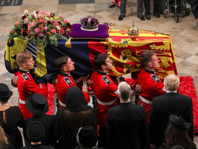 The coffin of Queen Elizabeth II is carried into Westminster Abbey for the State Funeral. (Photo by Phil Noble - WPA Pool/Getty Images)