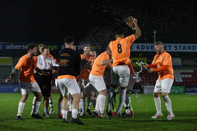 Edgehill get the champagne out to celebrate their final win.