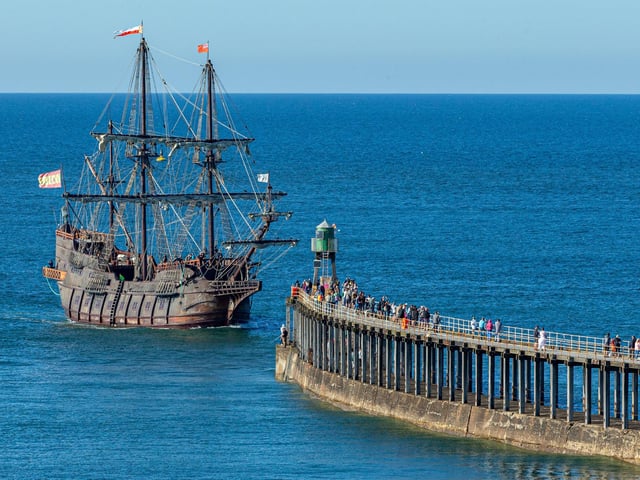 A spectacular sight as the replica heads for the pier entrance.