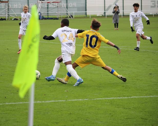 MJ Opoku running past Leeds United defender