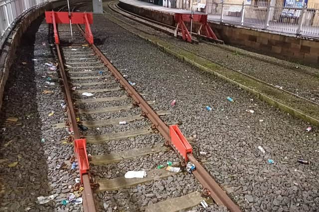 Litter covers the tracks at the station - Image: Nigel Roake