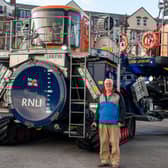 Malcolm Hastie stood with Bridlington RNLI Shannon Launch and Recovery System he helped design.