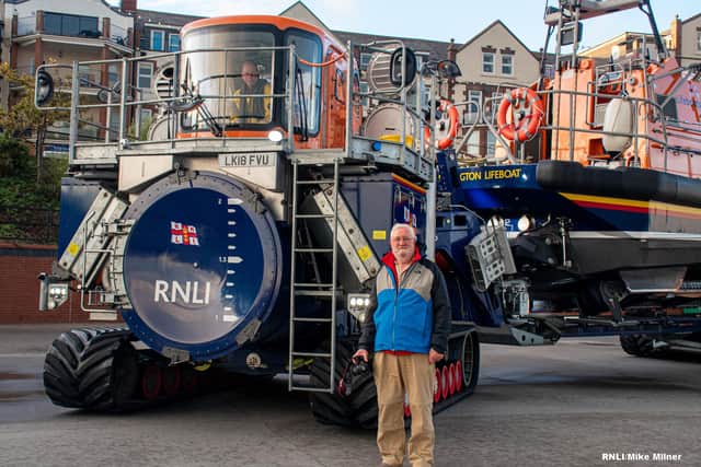 Malcolm Hastie stood with Bridlington RNLI Shannon Launch and Recovery System he helped design.