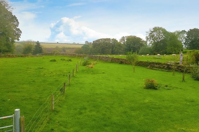 The property has an adjoining paddock of around a third of an acre, and two stables.