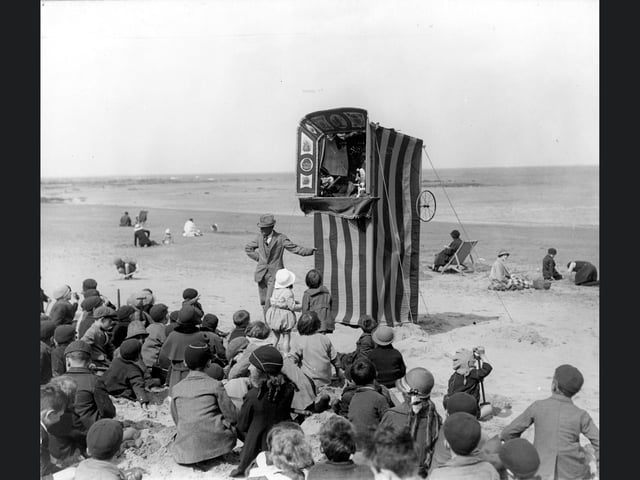 A Punch and Judy show at Scarborough during the Edwardian period.