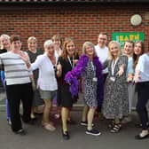 Staff celebrate the opening