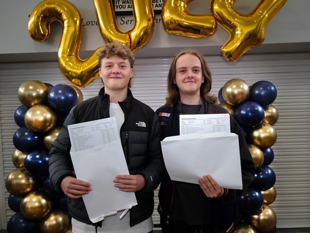 Twins Zack and Oliver with their results.