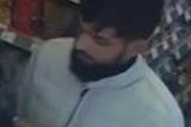 CCTV image of a man police would like to speak to, following a theft from Holland and Barrett in Scarborough.