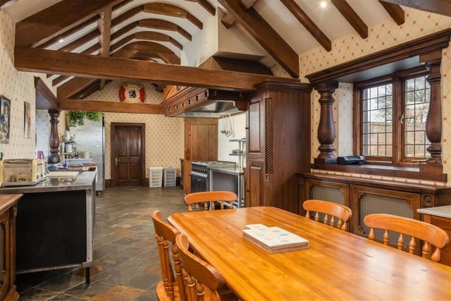 The large kitchen and diner has open vaults with beams to the ceiling.