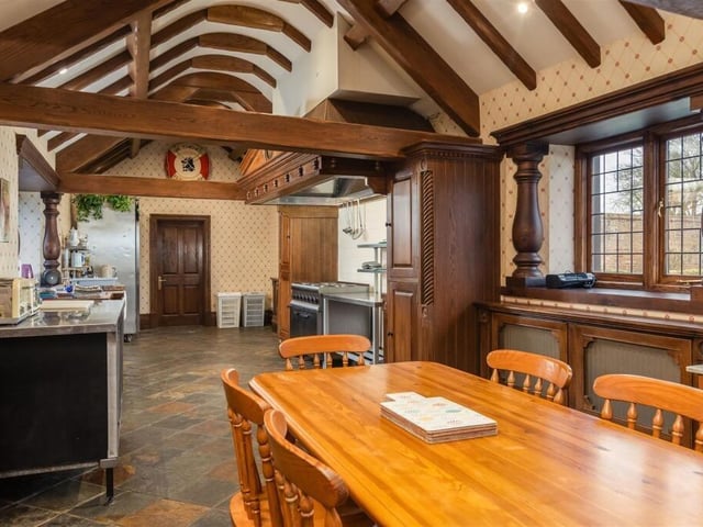 The large kitchen and diner has open vaults with beams to the ceiling.