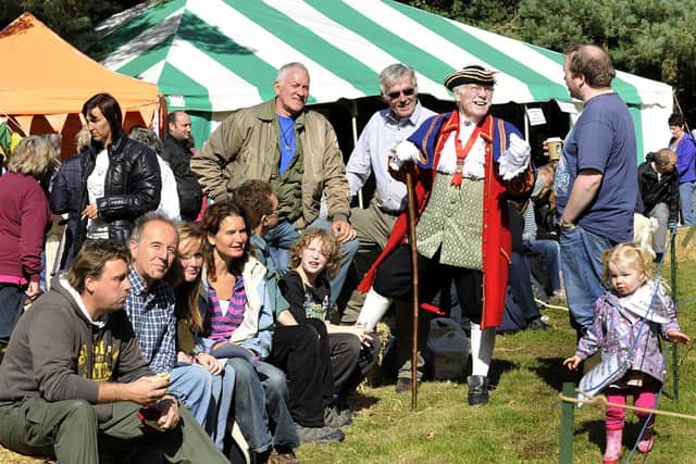 Former town crier Alan Booth chats with visitors at the Secret Wood event in 2013.
