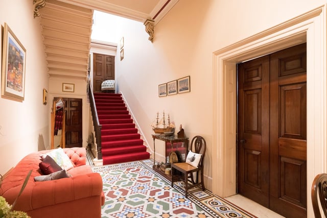 The majestic property has its original staircase.