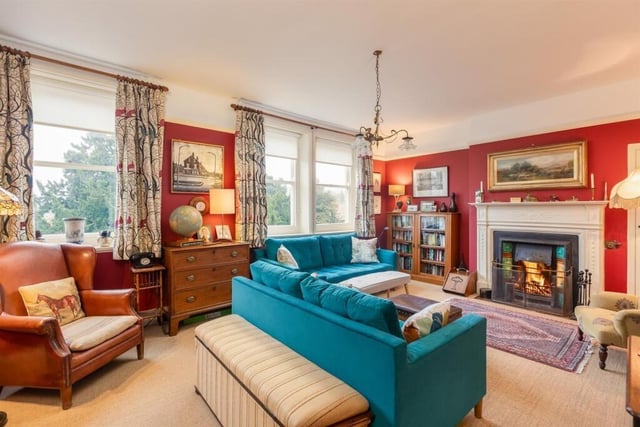 Large windows light up this stunning sitting room.