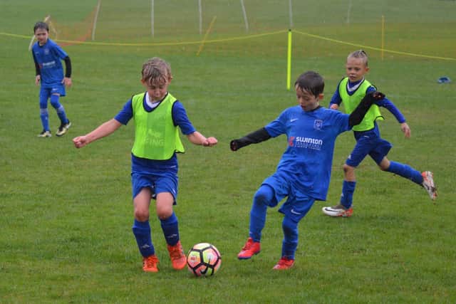 Heslerton Hawks U8s take on Old Malton. Photo by Cherie Allardice