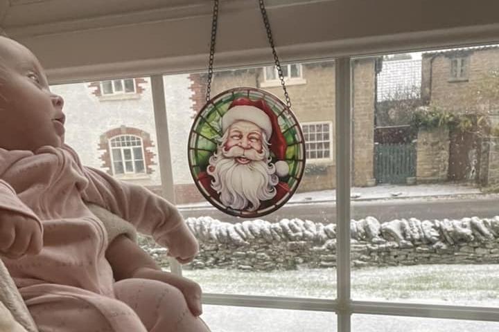 Baby girl's first snowfall