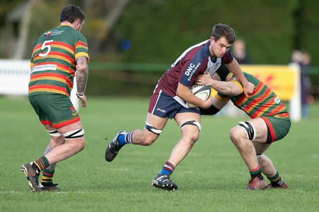 Selby try to halt Scarborough's Rufus Pollard. Photo by Andy Standing