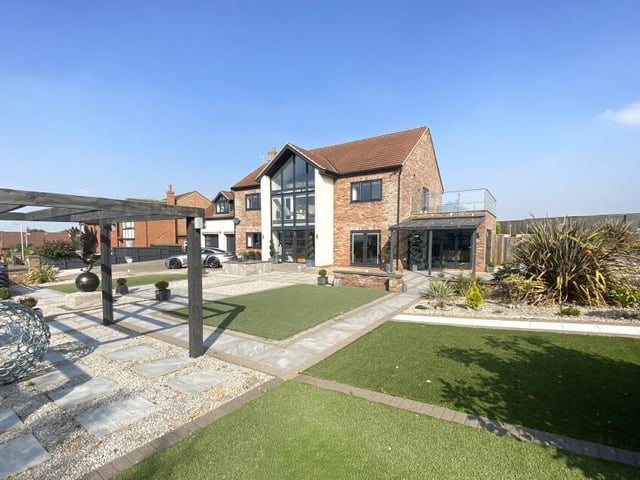 The impressive landscaped gardens to the front of the house.