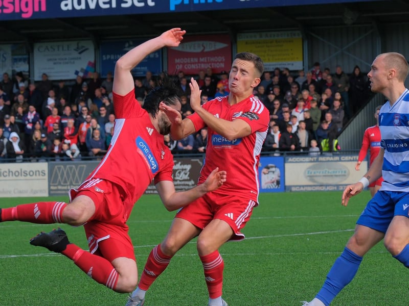 Midfielders Alex Purver and Lewis Maloney collide during the cup game.