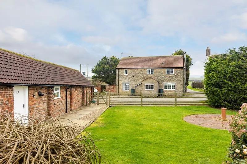 A residential and equestrian smallholding with fully furnished holiday cottages, situated in an attractive rural position on the edge of Filey. Currently listed for sale with Cundalls - Pickering at a guide price of £795,000.