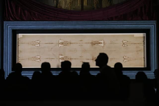 The actual Turin Shroud on display in Italy in 2015 - Photo: MARCO BERTORELLO/AFP via Getty Images