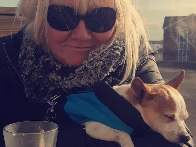 Kim Arrand and her gorgeous dog, who looks to be having a snooze!
