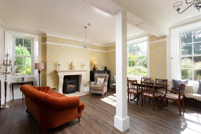 The drawing room has a new bespoke stone fireplace, with a log burner.