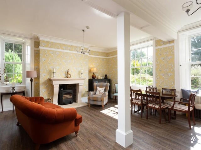The drawing room has a new bespoke stone fireplace, with a log burner.
