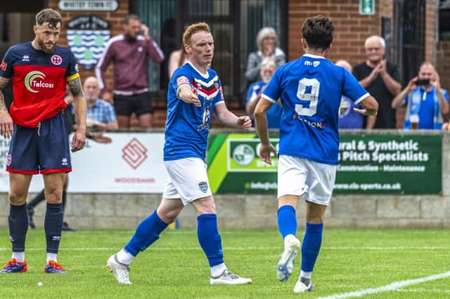 Michael Woods, left, makes it 3-3 late on for the home side. Photo by Brian Murfield.