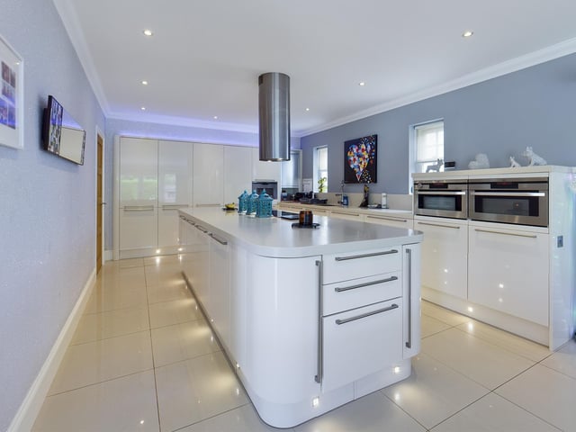 A large central island is a feature of the breakfasting kitchen.