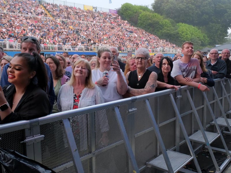 Fans recording the moment on camera.