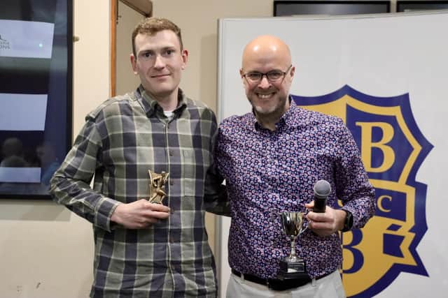 Dom Bond, left, picks his awards up from club chairman Martin Hutchinson