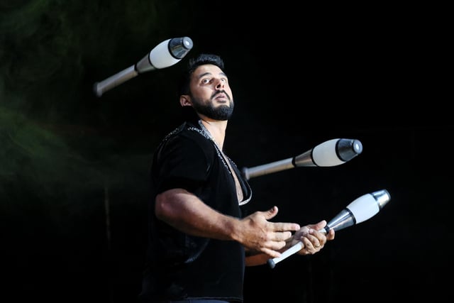 A talented juggler puts on a show.