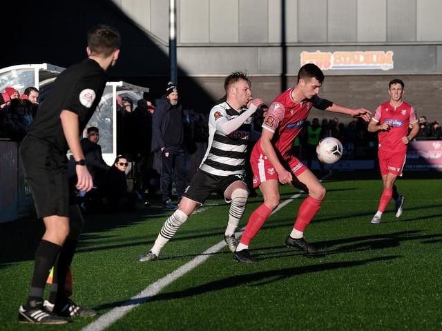 The impressive Luca Colville tries to hold off a challenge from the visitors