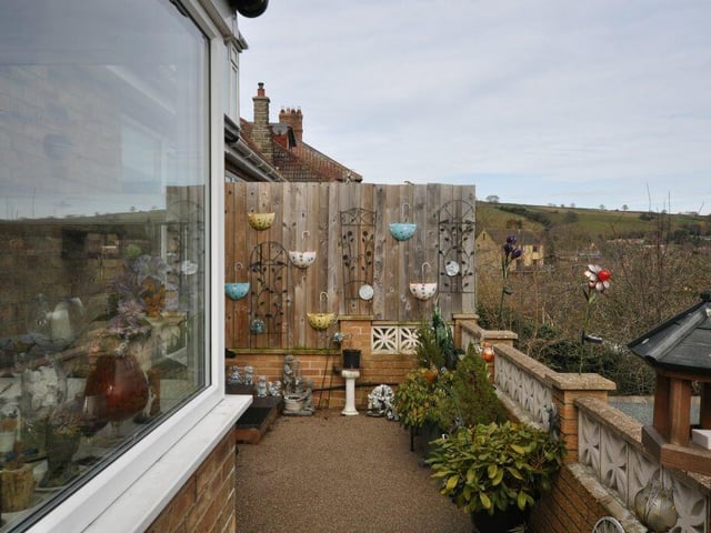A top tier patio area with country vista.